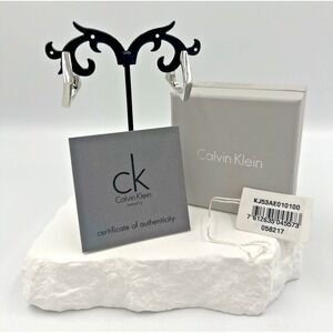 Calvin Klein Silver Tone Geometrical Twisted Square Huggie Earrings NWT..